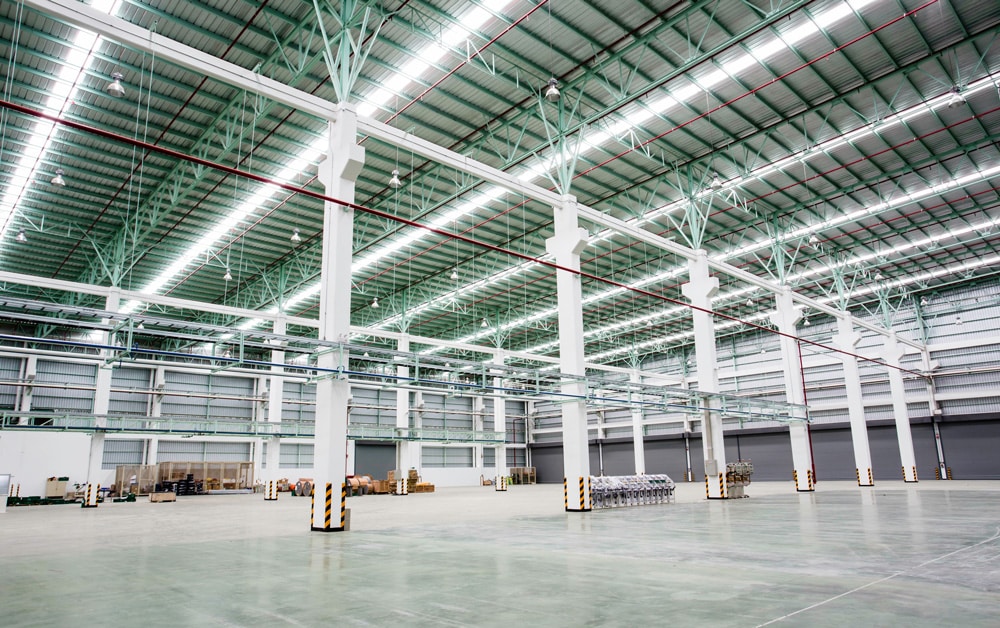 Empty warehouse with white pillars